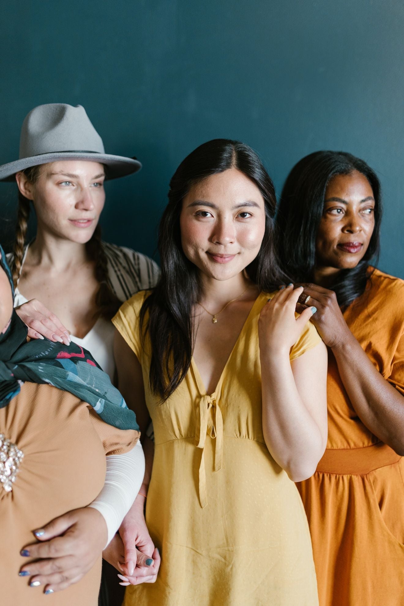 Four women grouped together