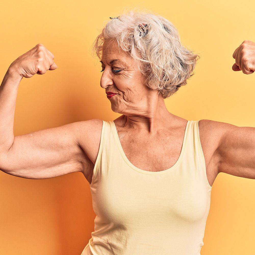 Mature lady on yellow background